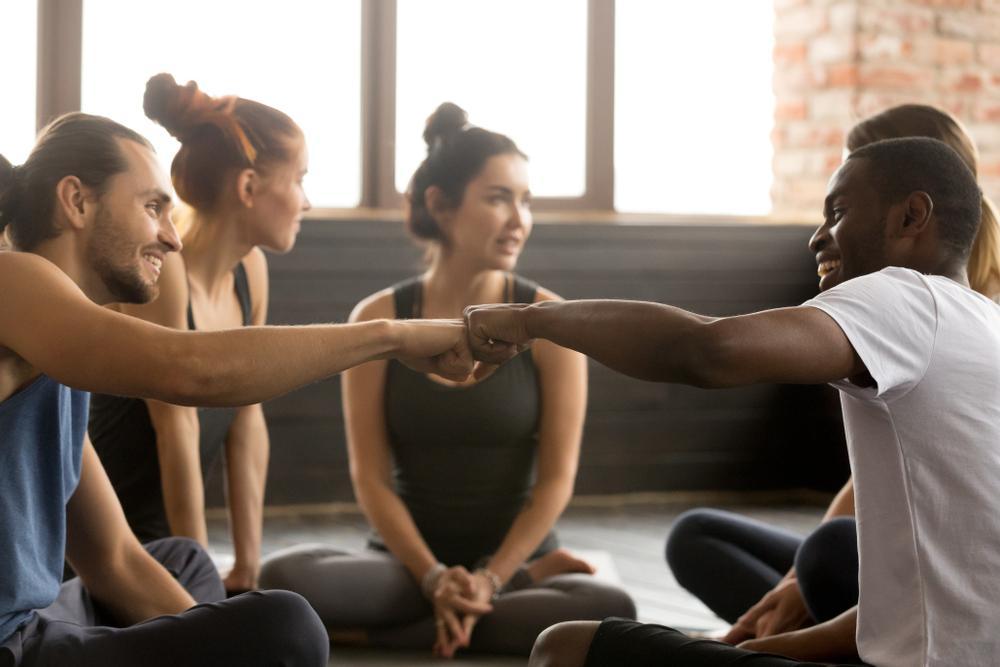 Smiling,Sporty,Fit,African,American,And,Caucasian,Men,Fist,Bumping